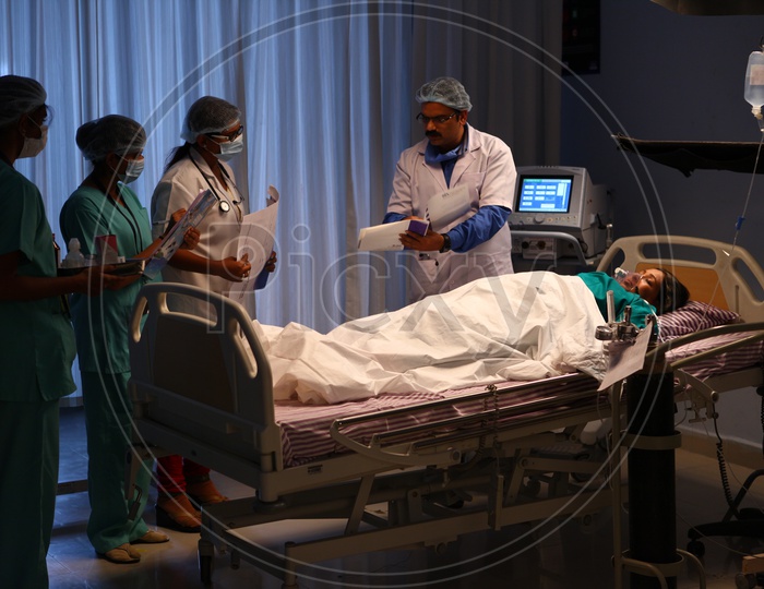 Doctor Treating a Patient in a Hospital ICU operation Theater