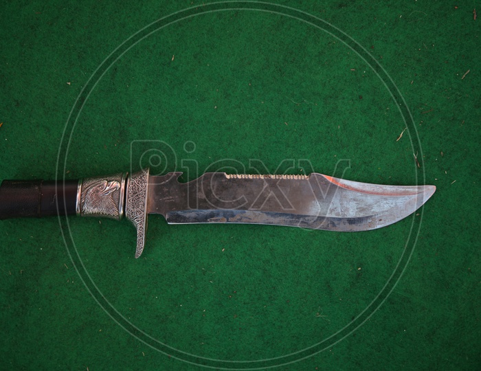 Designed Knife Chaku on an Isolated Green isolated Background