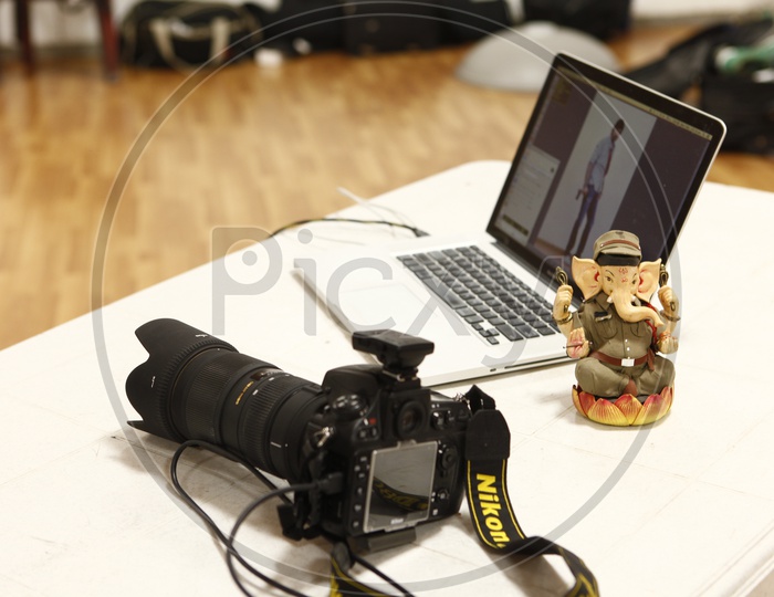 Model Photo shoot  Scenes With DSLR Camera and Laptop