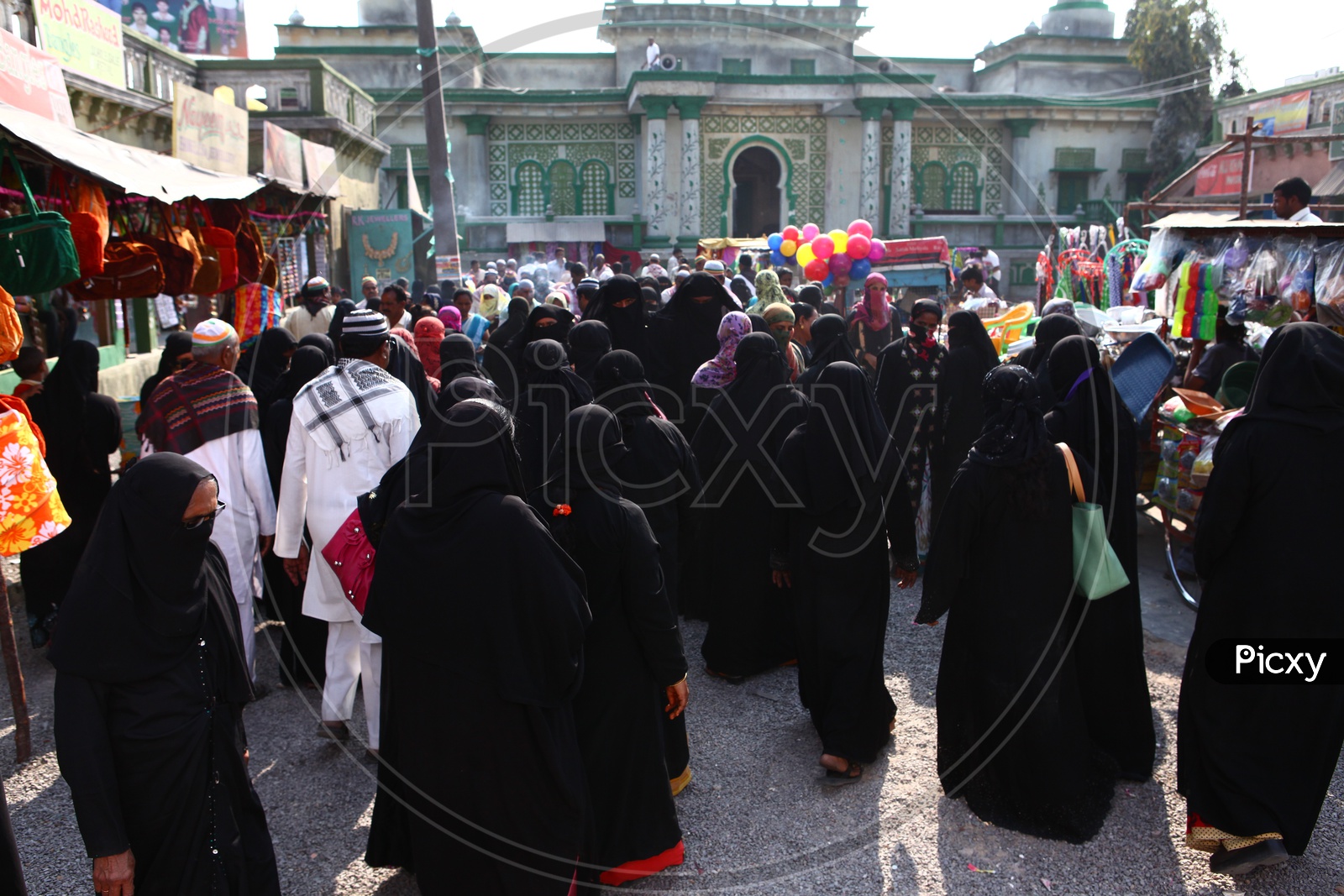 Muslim Woman Shopping in a vendor Street