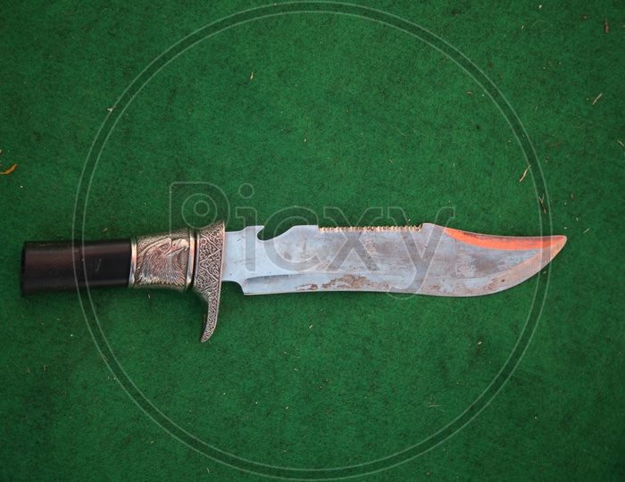 Designed Knife Chaku on an Isolated Green isolated Background