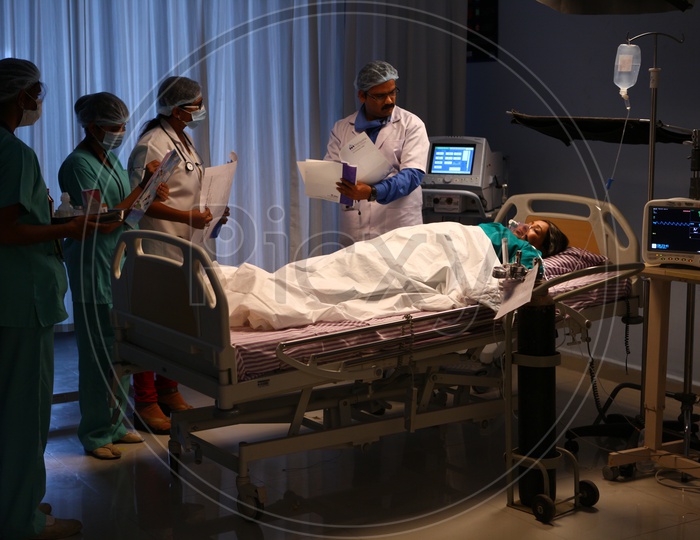 Doctor Treating a Patient in a Hospital ICU operation Theater