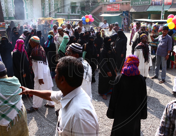 A Busy Street Or Vendor Street With Muslim  Woman