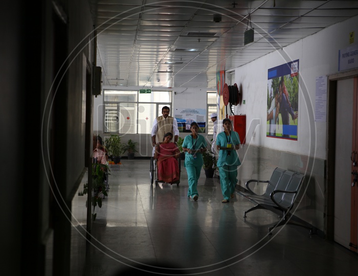 Patients In Wheel Chairs in a Hospital Corridor