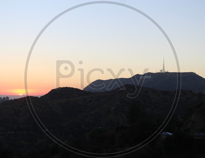 Sunset next to Hollywood Symbol
