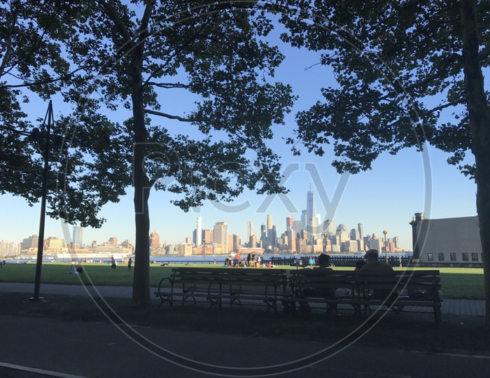 Enjoying the view of the skyline from a bench