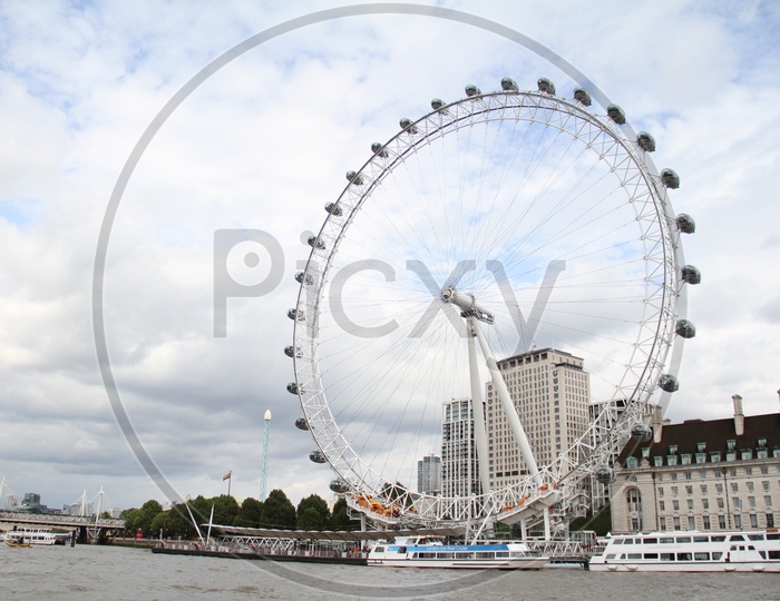 Boats on Thames River with London Eye with Background