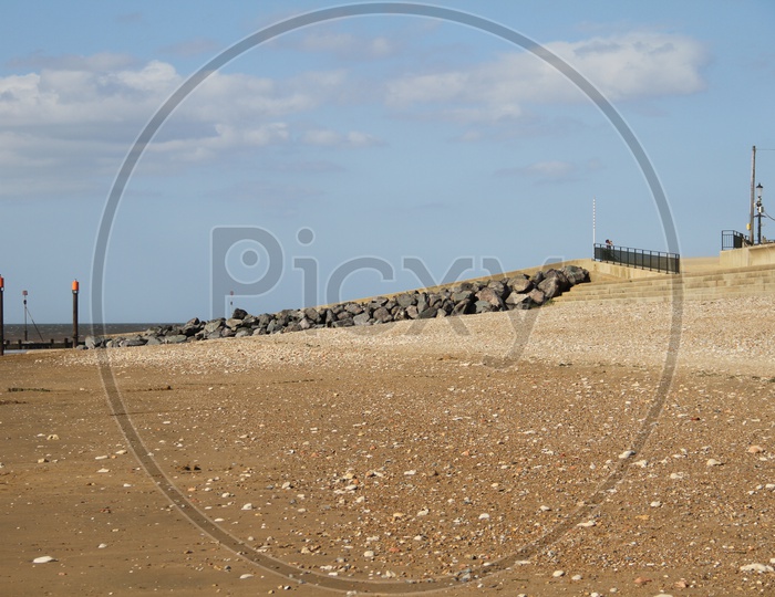 Heacham Beach with Stones and Clouds in Background