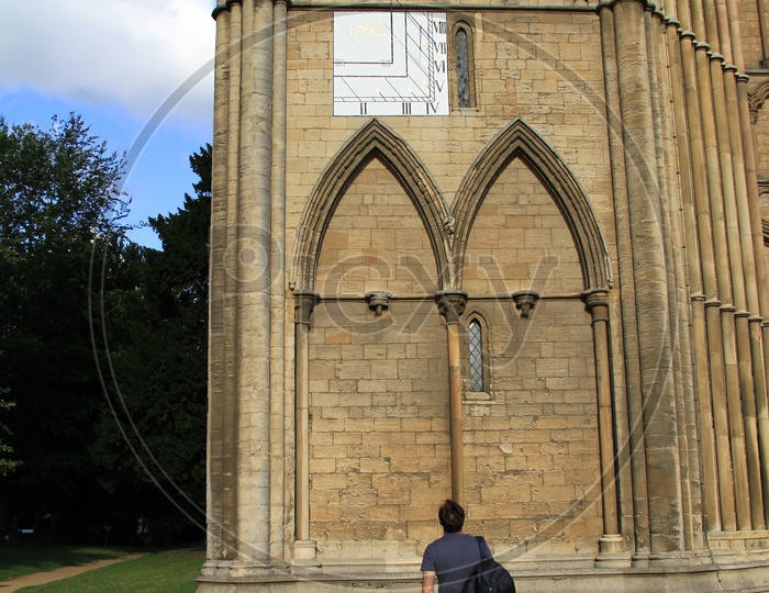 Man looking at Architecture of Peterborough Cathedral