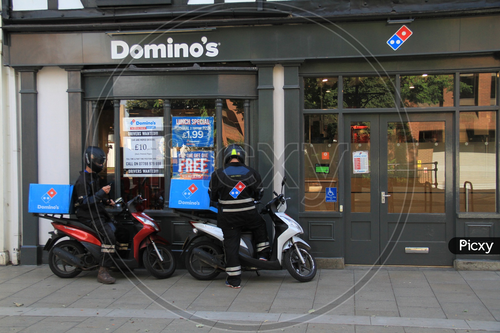 Domino's Delivery Boys with Bikes outside a Outlet