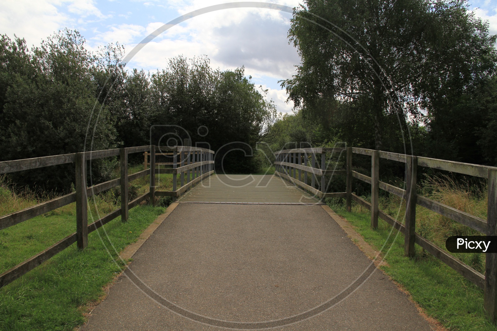 Pathway with a Small Bridge in Ferry Meadows Caravan and Motorhome Club Site