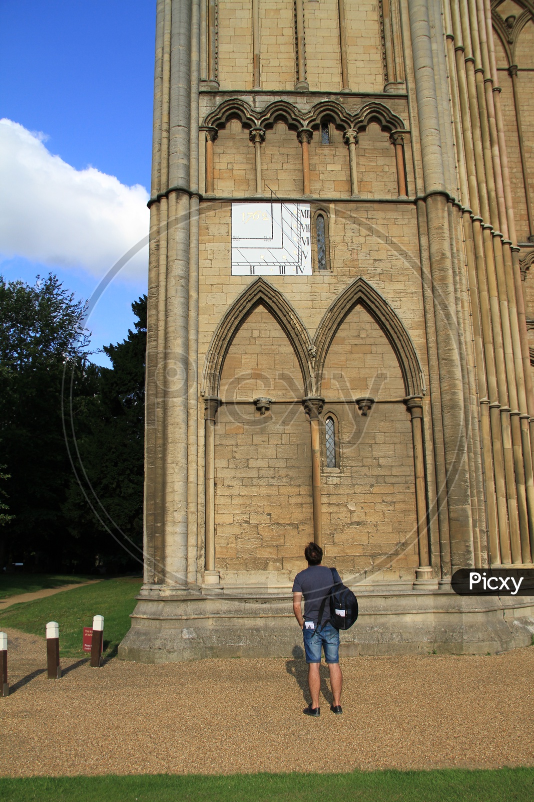 Man looking at Architecture of Peterborough Cathedral