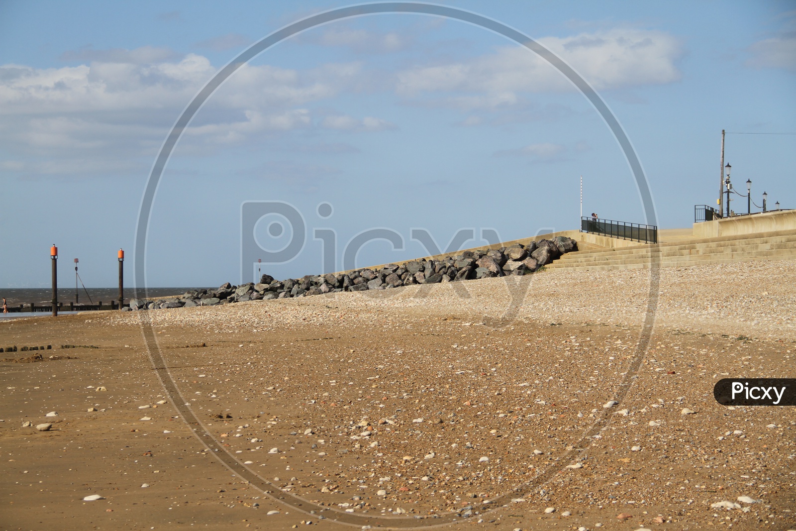 Heacham Beach with Stones and Clouds in Background