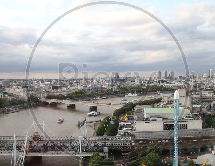 Aerial View of London Cityscape with Boats in Thames River