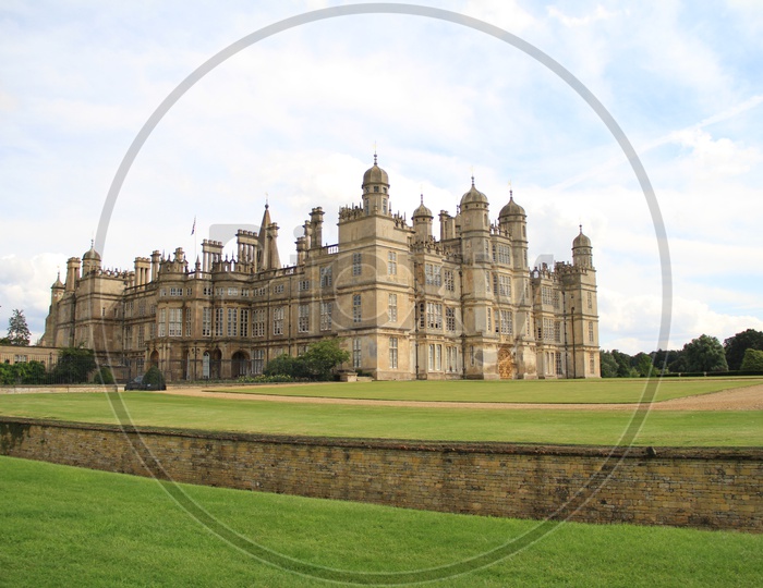 Burghley House with Clouds in Sky