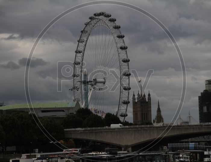 London Eye with clouds in Sky Background