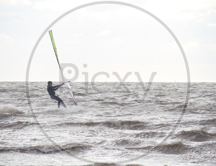 Male having fun with Kite Surfing on Beach, Adventure Beach Sports