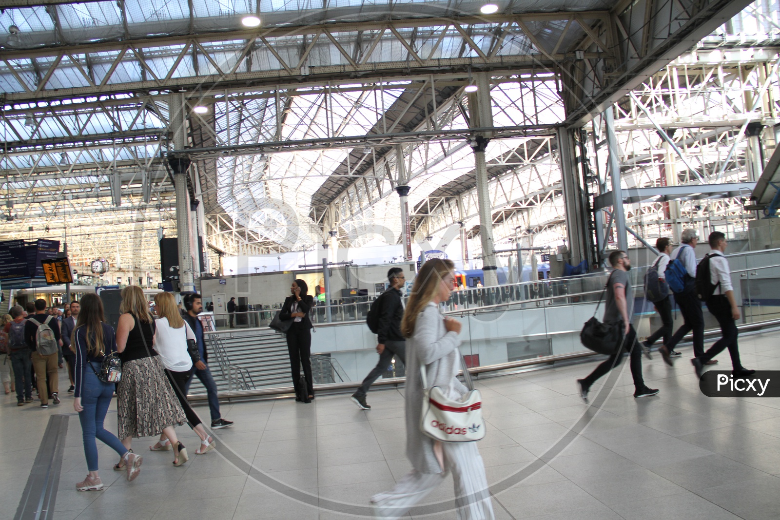 People walking inside Waterloo Railway Station