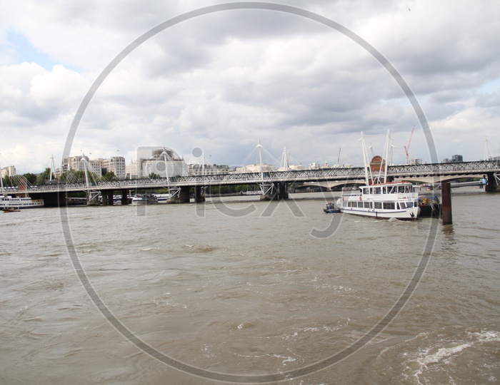 Unidentified Boats crossing Hungerford Bridge