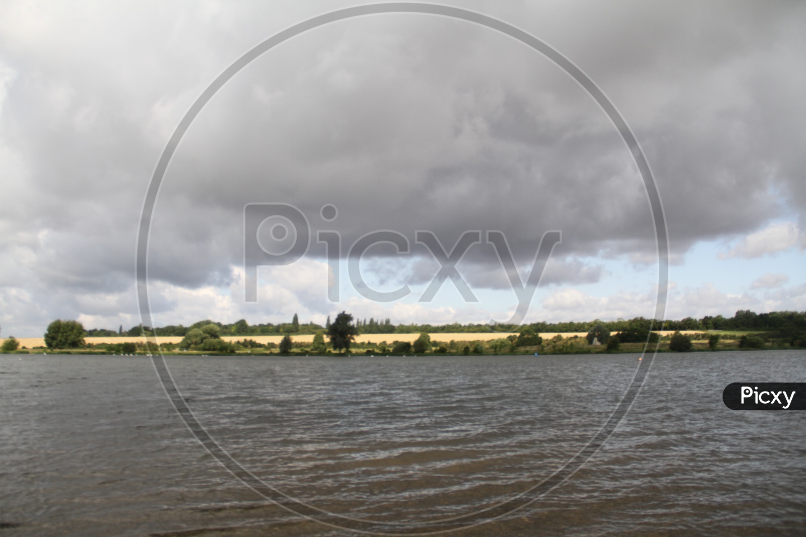 Lake with Dark Clouds in Background