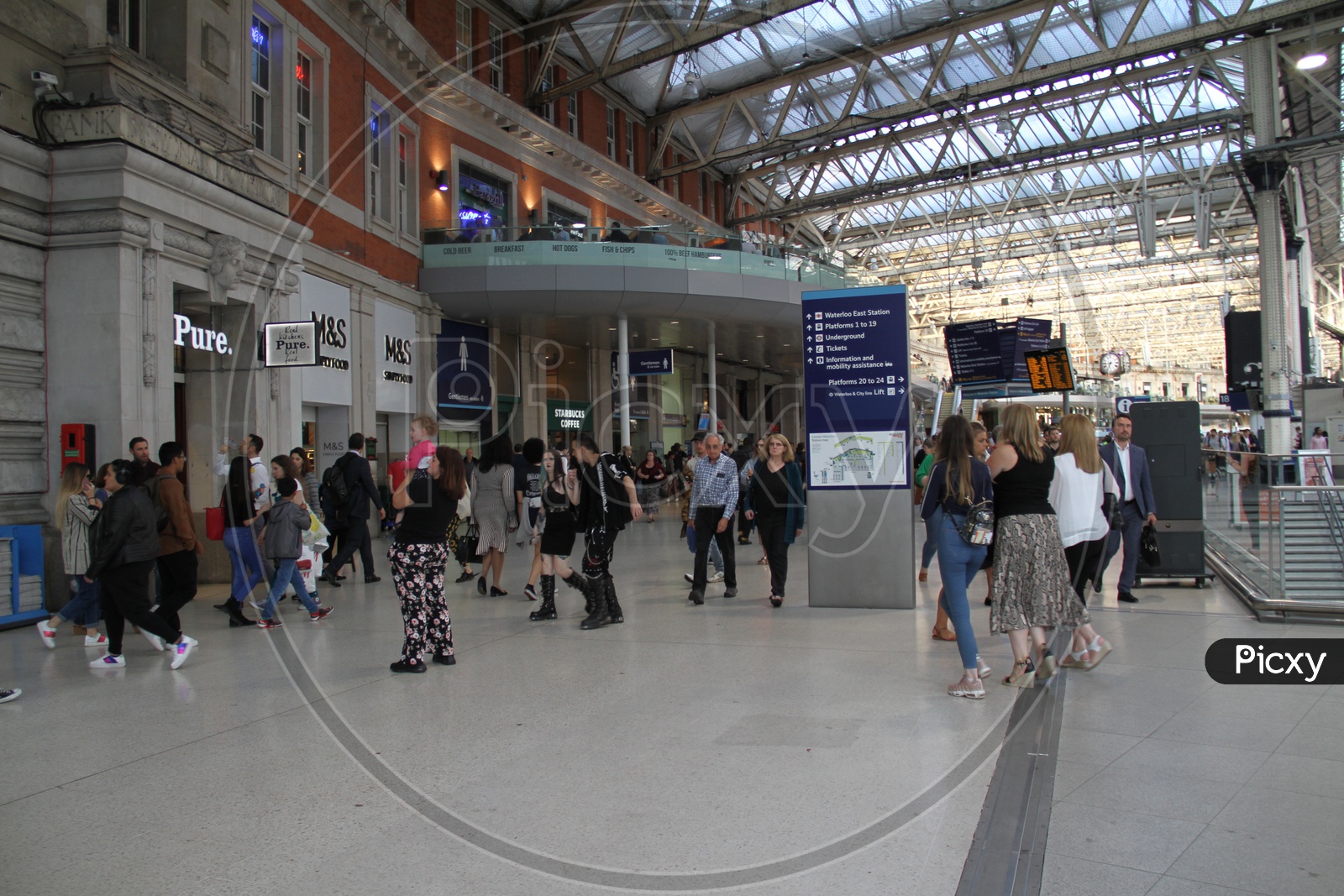 People walking in Waterloo Railway Station, London