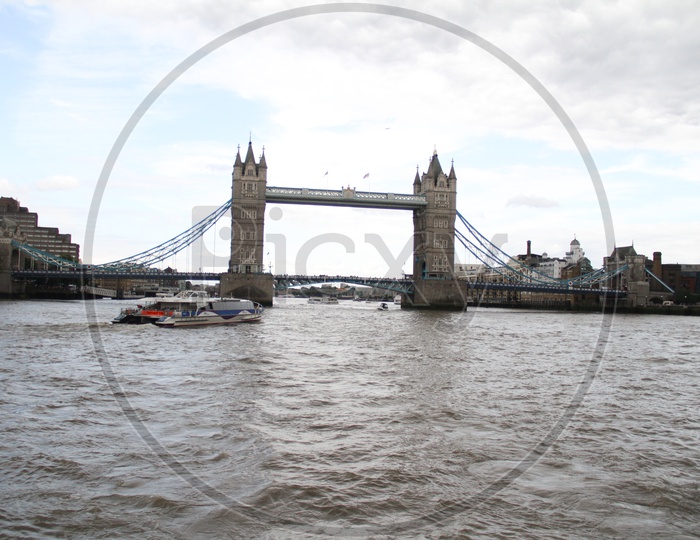 An Unidentified Boat on Thames River with Tower Bridge in Background