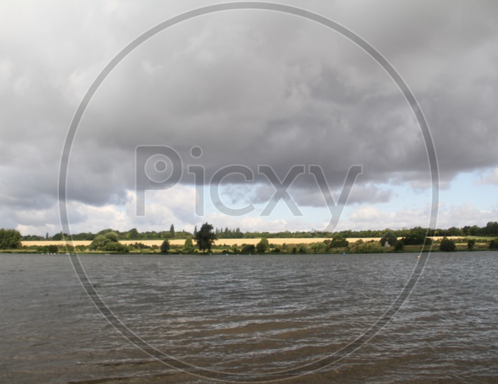 Lake with Dark Clouds in Background