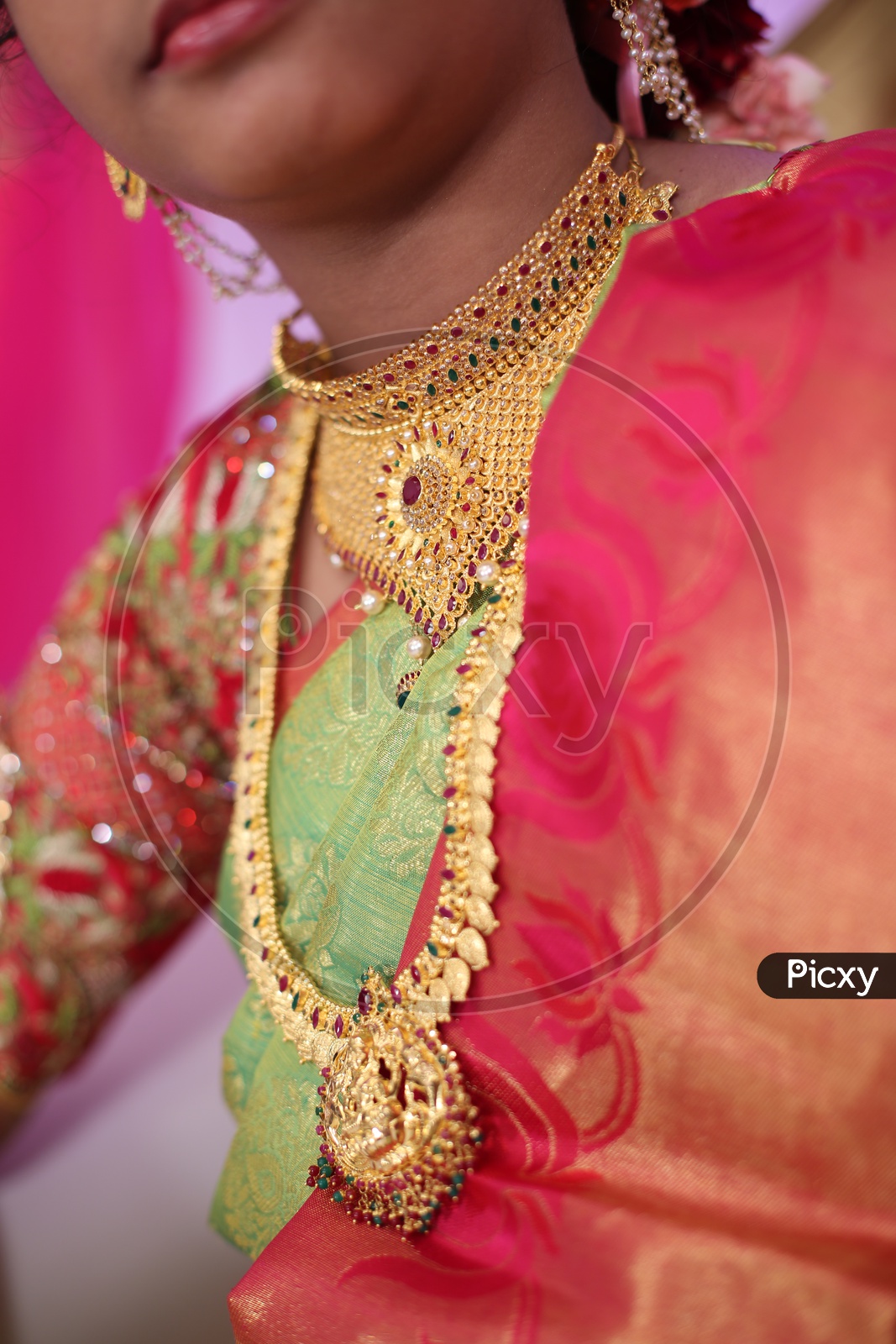 Indian Woman wearing Gold Haaram