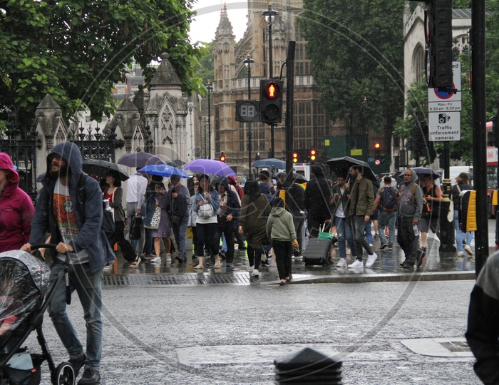 People walking on Footpath on a Rainy Day