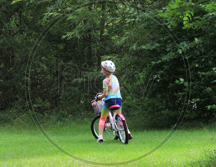 A Kid with Cycle in Ferry Meadows Caravan and Motorhome Club Site