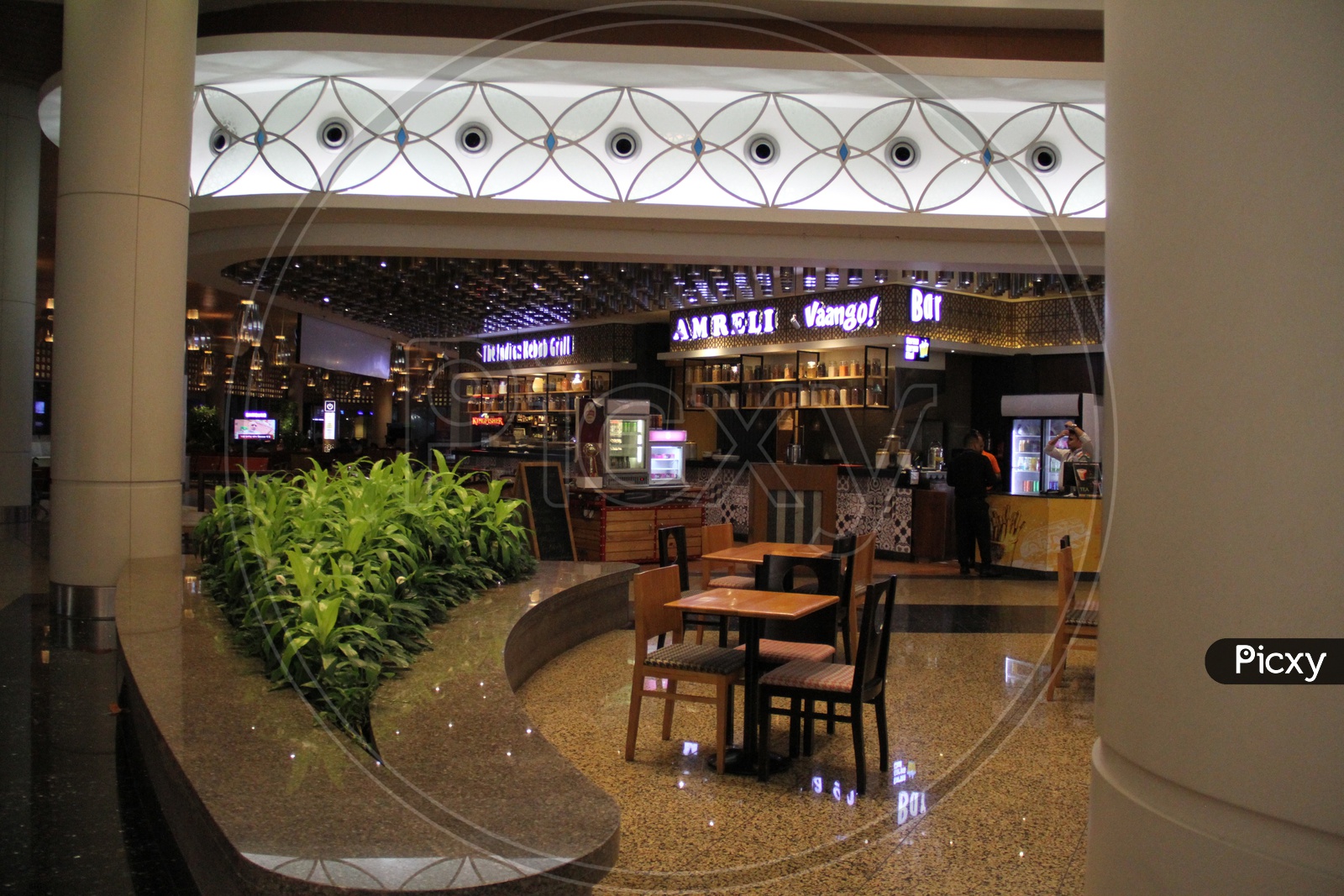 Cafes And restaurants In a Shopping Mall With Chairs And Tables