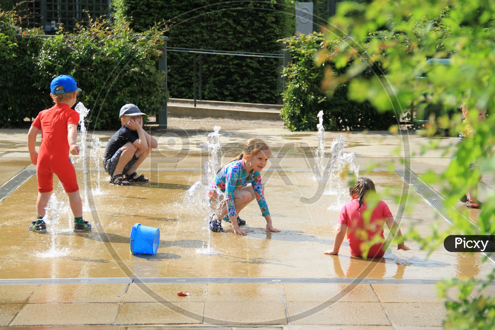 Kids Playing with Water at Fountain