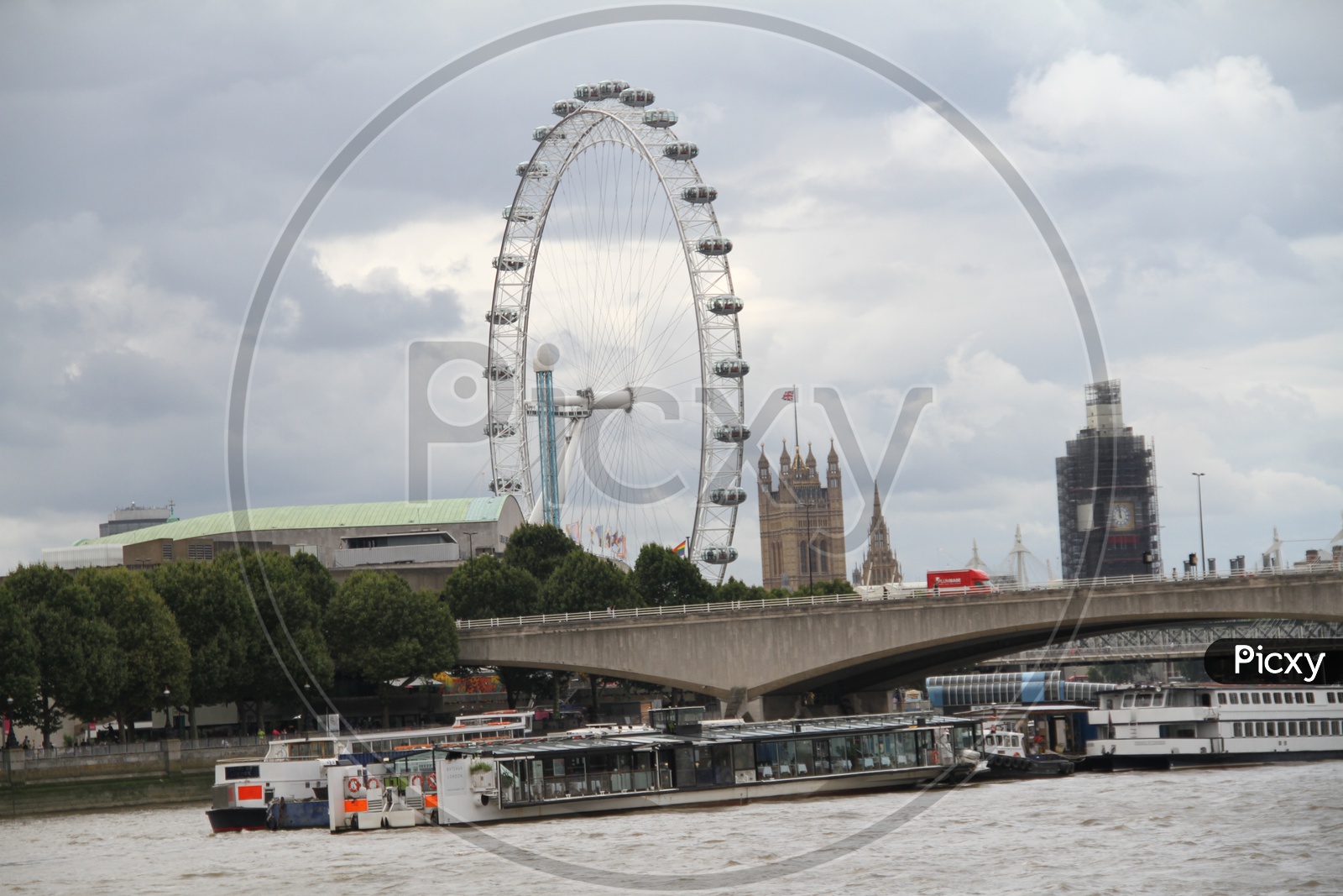London Eye Ferris Wheel shot from a Boat on Thames River