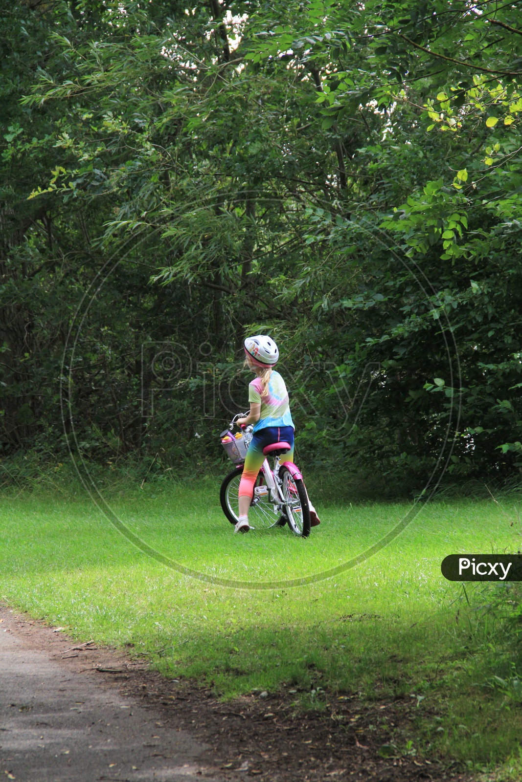 A Kid with Cycle in Ferry Meadows Caravan and Motorhome Club Site