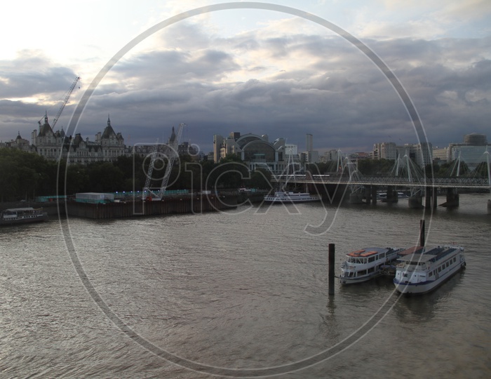 Unidentified Tourist Boats on Thames River with Hungerford Bridge
