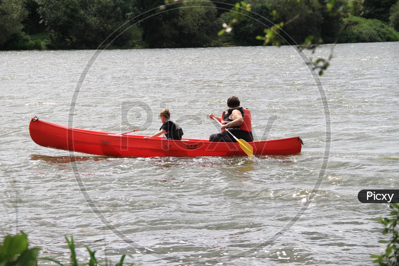 Woman with Kid Rafting a Boat in Lake