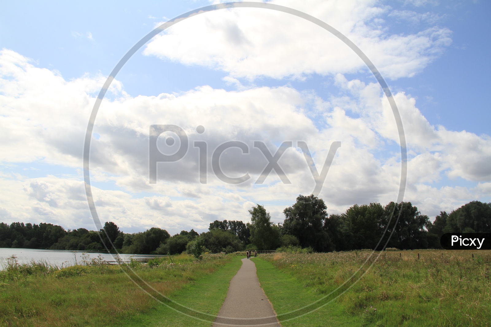 Pathway in Ferry Meadows Caravan and Motorhome Club Site with Clouds in Sky Background