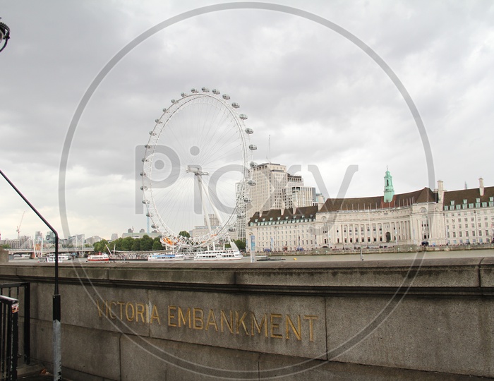 London Eye with Building in Background
