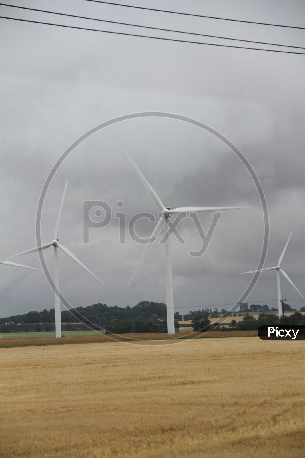Wind Turbines with Clouds in Sky Background