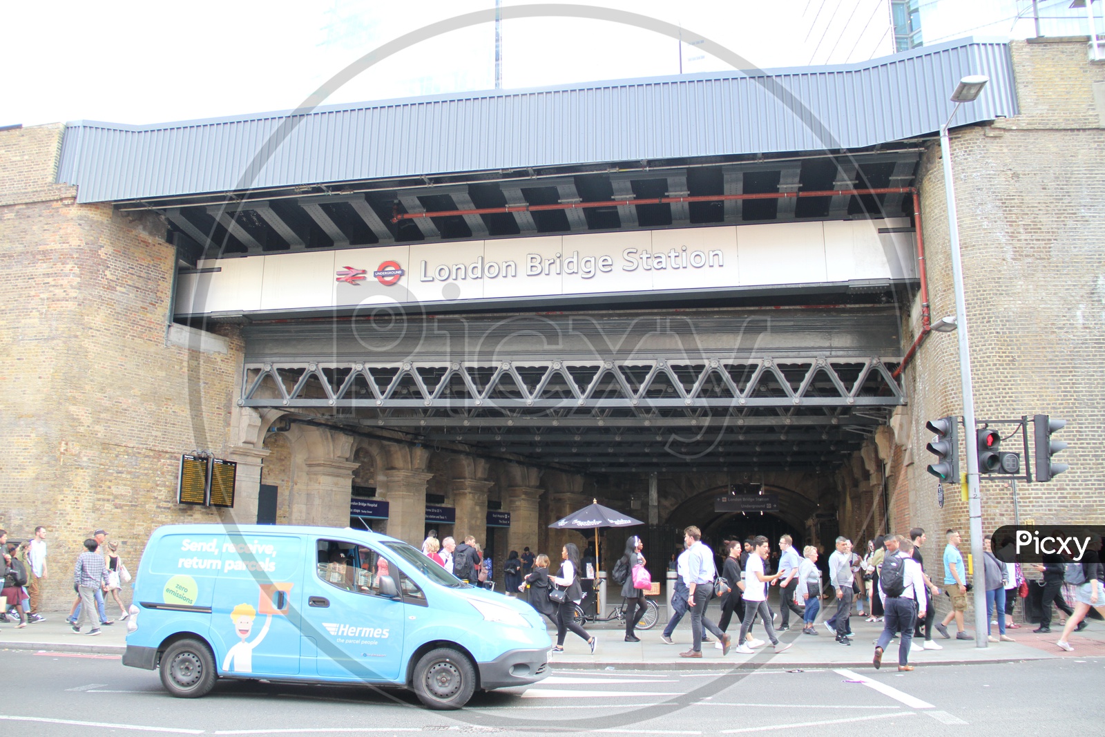 People walking on Footpath at London Bridge Station