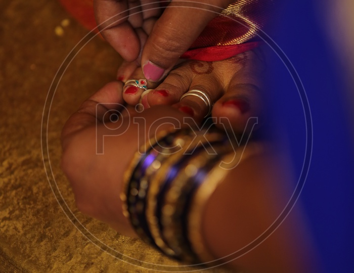 Indian Bride during presentation of Toe ring