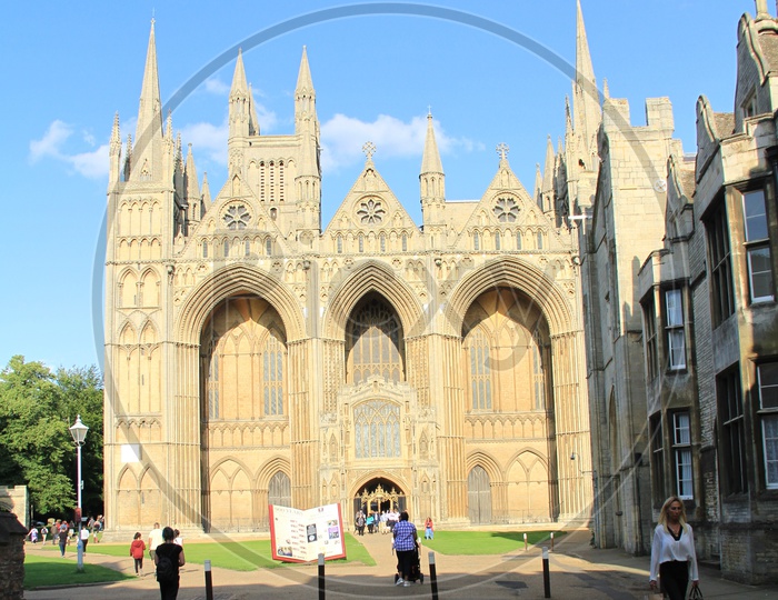 Tourists at Peterborough Cathedral with Clouds in Sky