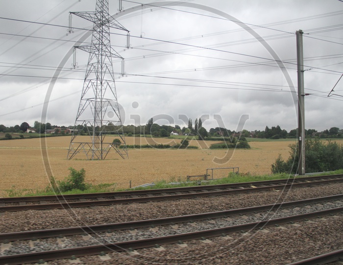 Power Transmission Lines in Agriculture Fields near Railway Tracks