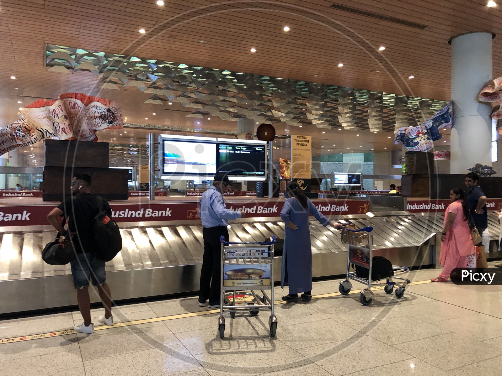 Airport Luggage Belt or Conveyor belt With Passengers Collecting Luggage Bags