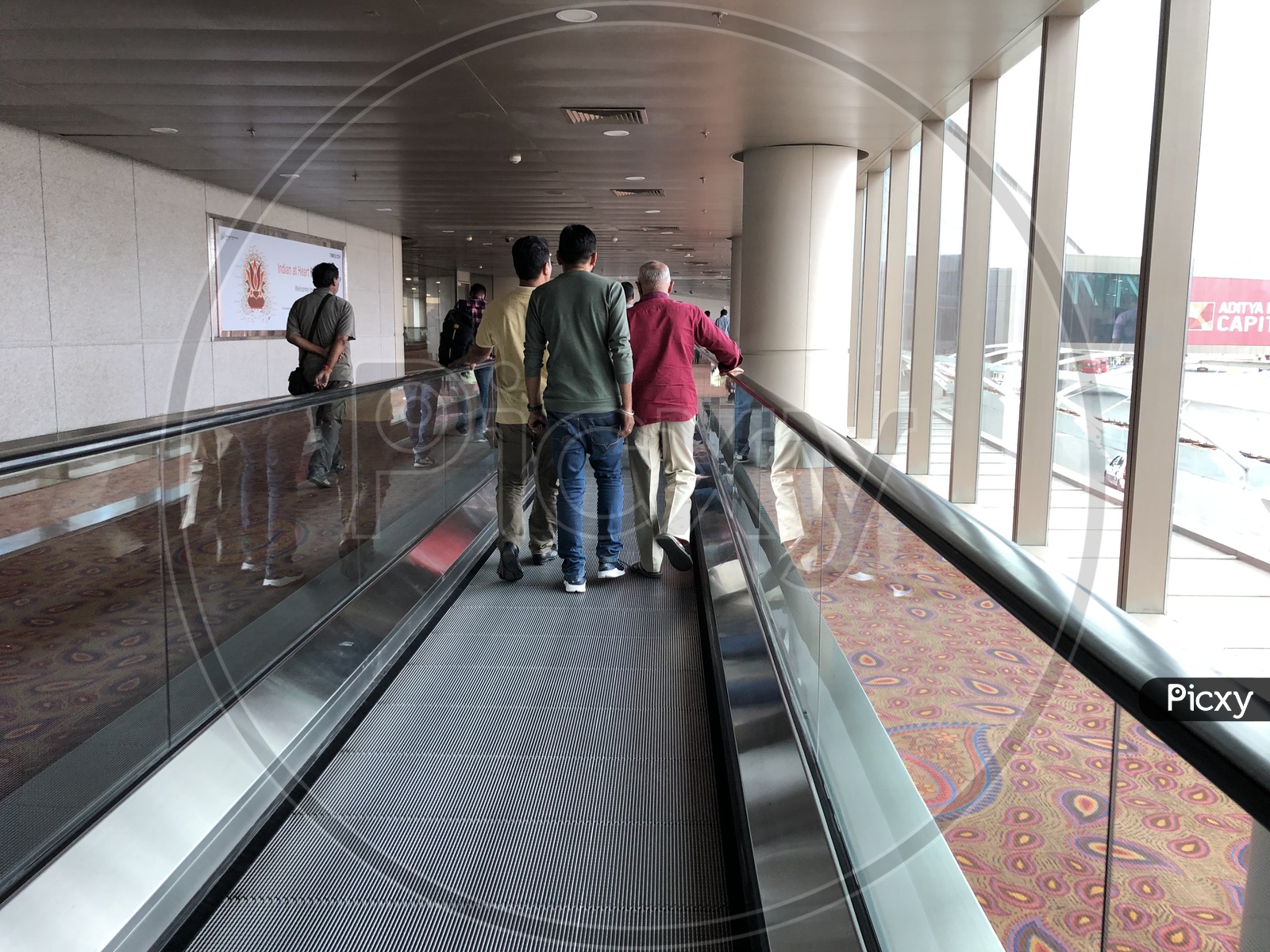 Flat Escalators in Airport With Passengers
