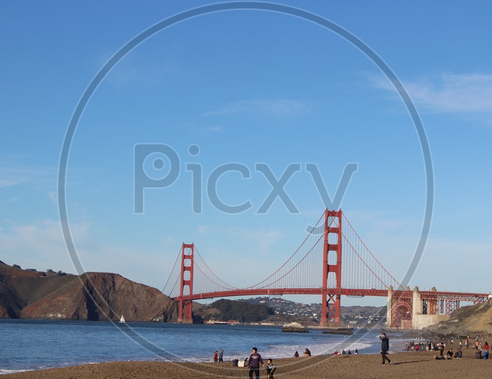 Tourists alongside the Golden Gate Bridge