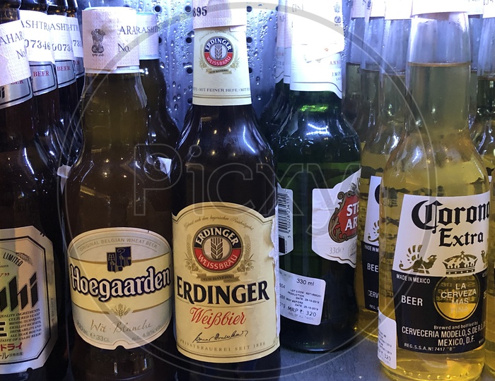 Beer Bottles Of Premium Companies Closeup