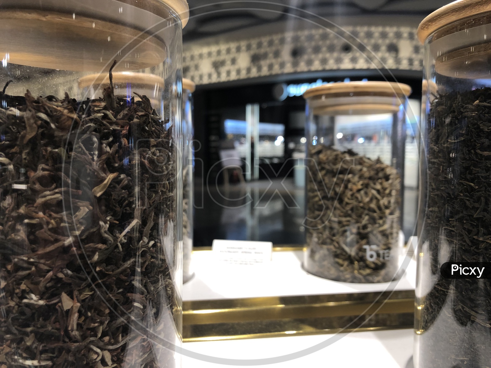 Closeup Of Tea Leafs In Glass Jars At TEABOX Store In Terminal 2 Of Mumbai Airport