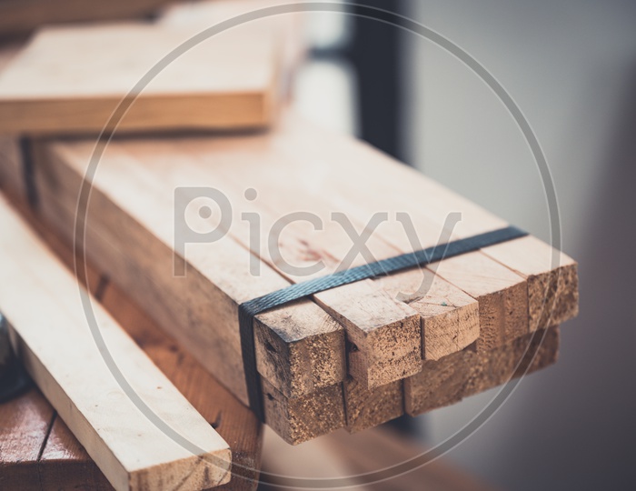 Cut Wooden Logs In a Carpentry Workshop For Furniture Making