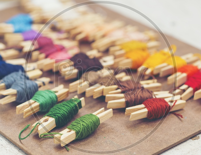 Colorful embroidery thread on an Wooden Table  With Selective Focus
